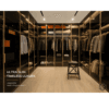 Slim aluminium glass cabinet door with integrated handle in gold finish