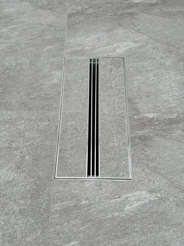 Side view showing stainless steel drain grating construction